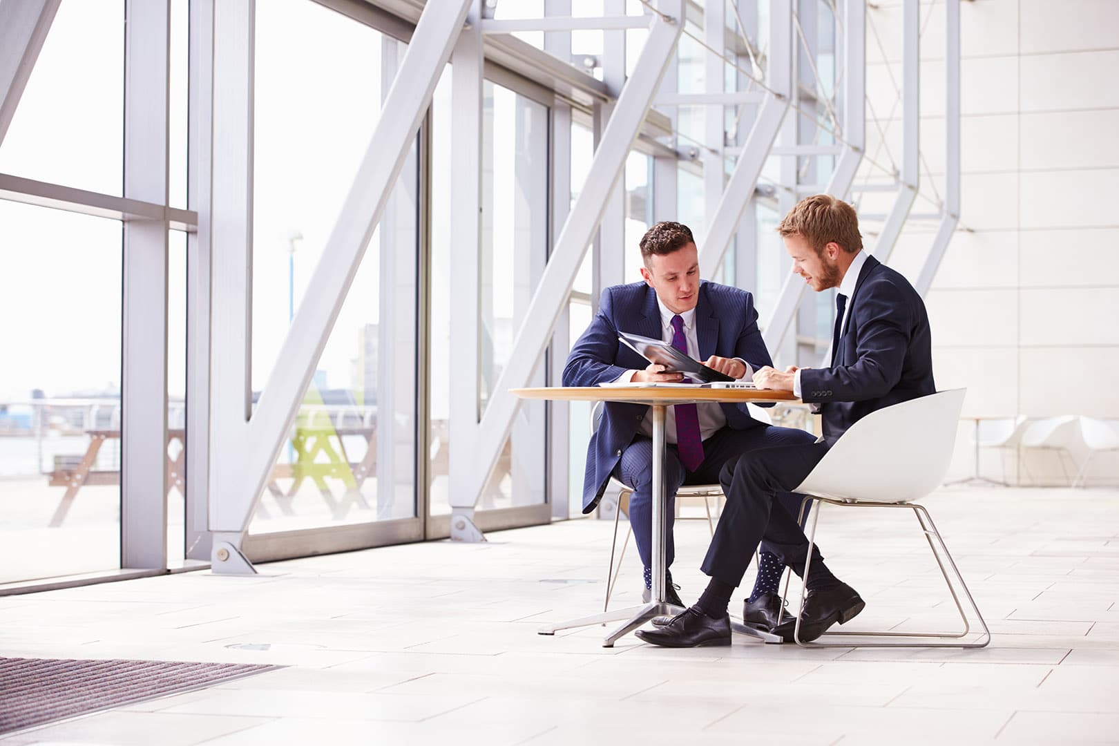 Two men meeting at a table